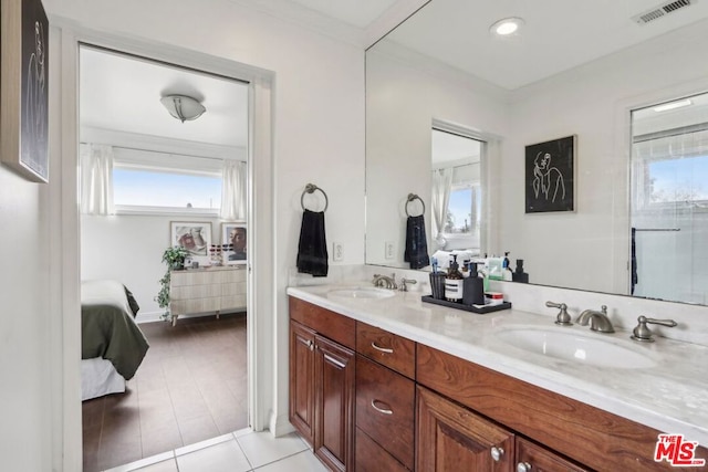 bathroom with tile patterned flooring and vanity