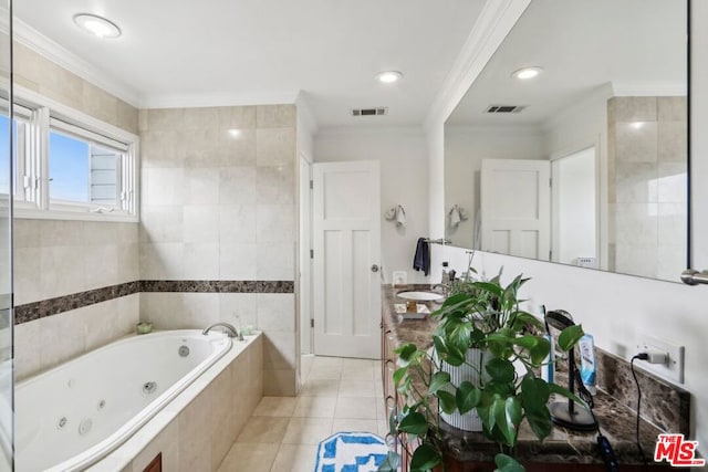 bathroom with vanity, tile patterned flooring, ornamental molding, tile walls, and tiled bath