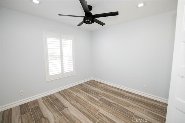 unfurnished room featuring ceiling fan and light hardwood / wood-style floors