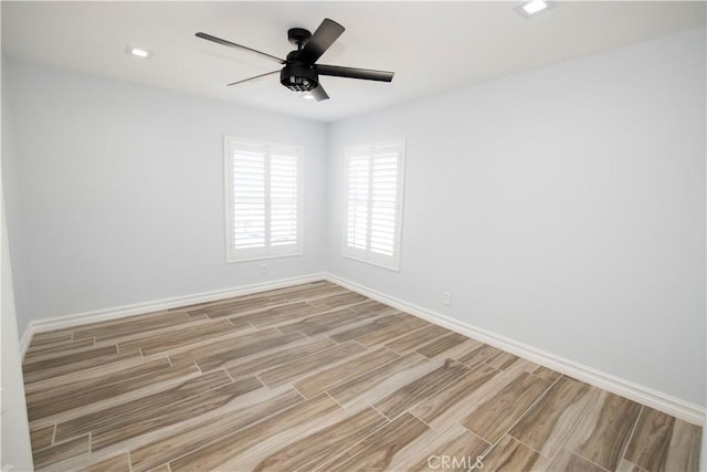 empty room featuring light hardwood / wood-style flooring and ceiling fan