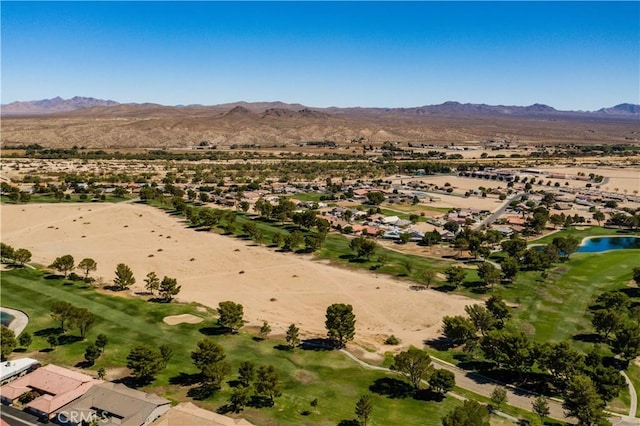 drone / aerial view featuring a water and mountain view