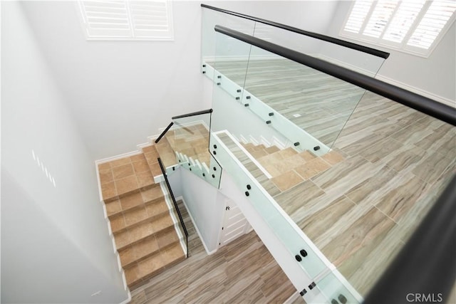 stairway featuring hardwood / wood-style floors