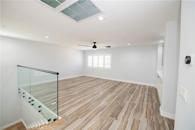 unfurnished room featuring ceiling fan and light hardwood / wood-style flooring