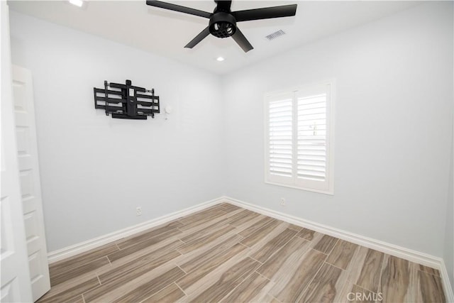 spare room featuring ceiling fan and light hardwood / wood-style floors