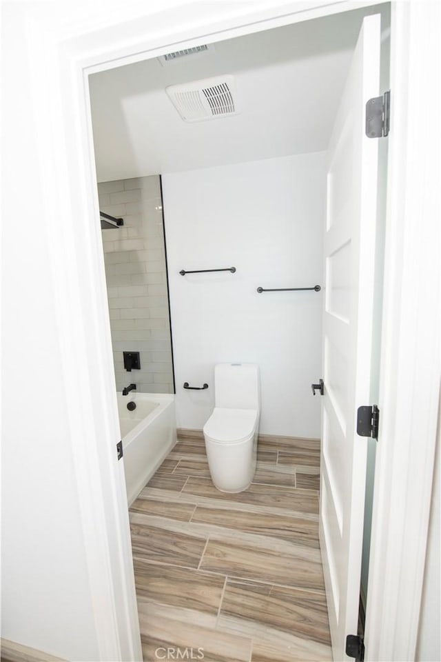 27404 Outrigger Ln, Helendale, CA 92342 - full bath with wood tiled floors, toilet, and  shower combination