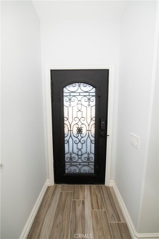 doorway featuring wood-type flooring