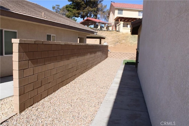 27404 Outrigger Ln, Helendale, CA 92342 - view of home's exterior featuring fence and stucco siding