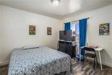 bedroom featuring dark hardwood / wood-style flooring