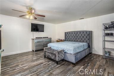 bedroom with ceiling fan and dark hardwood / wood-style flooring