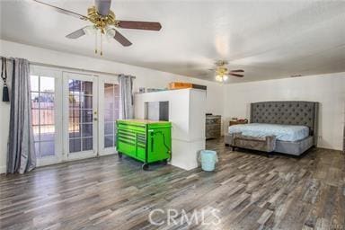 bedroom with ceiling fan, dark wood-type flooring, access to outside, and french doors