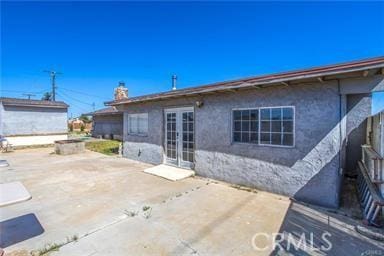 rear view of property with a patio area