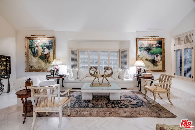 sitting room featuring light parquet floors and lofted ceiling