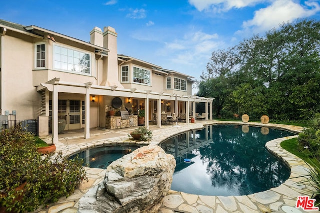 rear view of house with area for grilling, a swimming pool with hot tub, cooling unit, and a patio