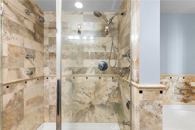 bathroom featuring a shower with door