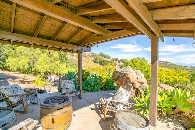 view of patio featuring an outdoor fire pit