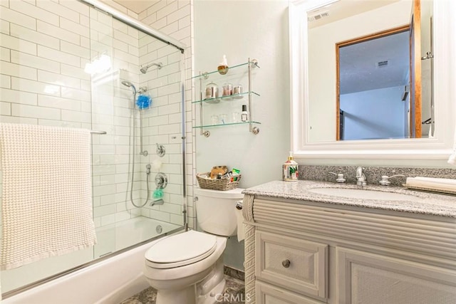 full bathroom with vanity, toilet, and enclosed tub / shower combo