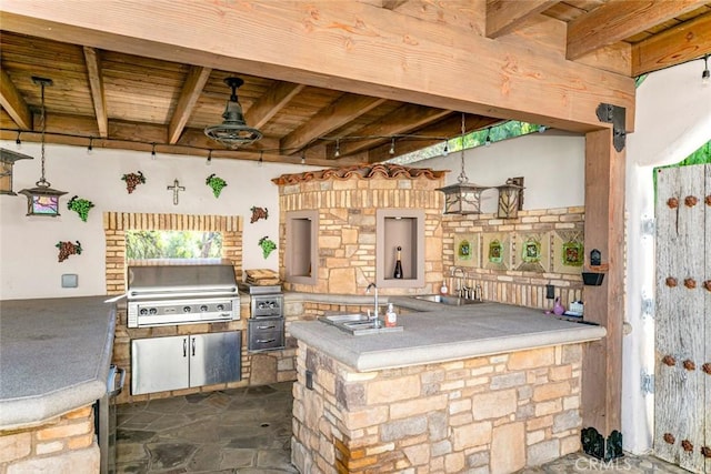 view of patio with an outdoor kitchen, a grill, sink, and ceiling fan