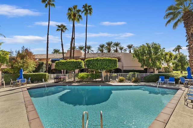 view of swimming pool with a patio