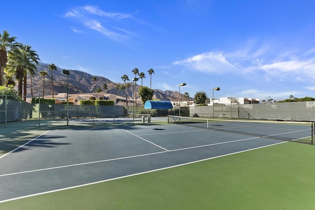 view of sport court with a mountain view