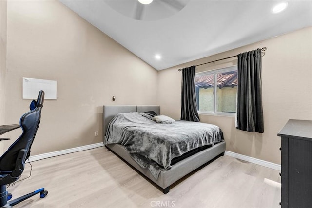 bedroom with lofted ceiling, recessed lighting, ceiling fan, light wood-type flooring, and baseboards