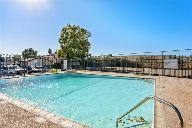 community pool featuring fence