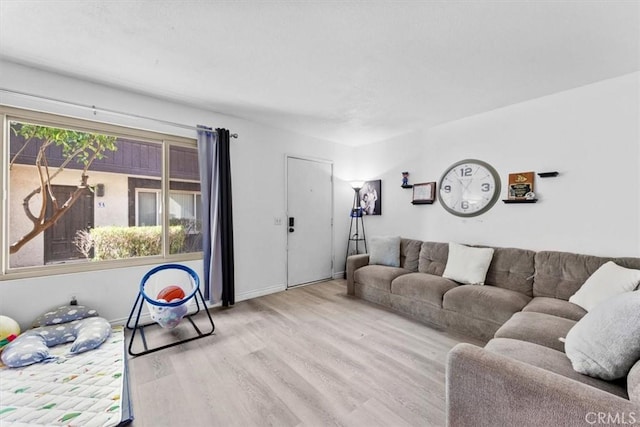 living room with wood finished floors and baseboards