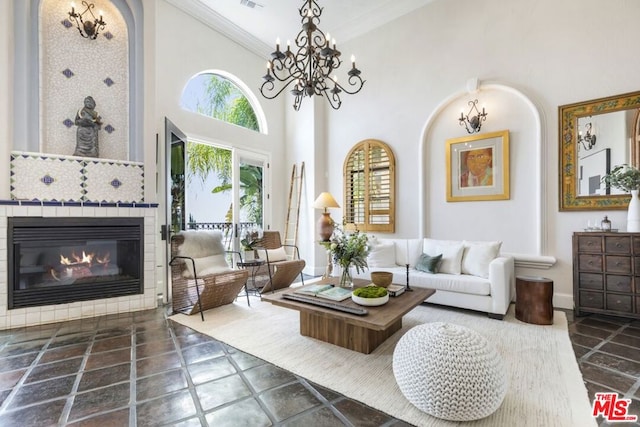 living room featuring a high ceiling and crown molding