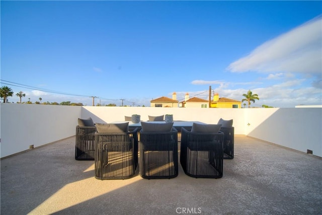 view of patio featuring fence