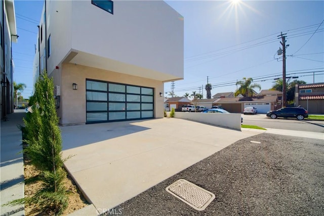 exterior space with concrete driveway