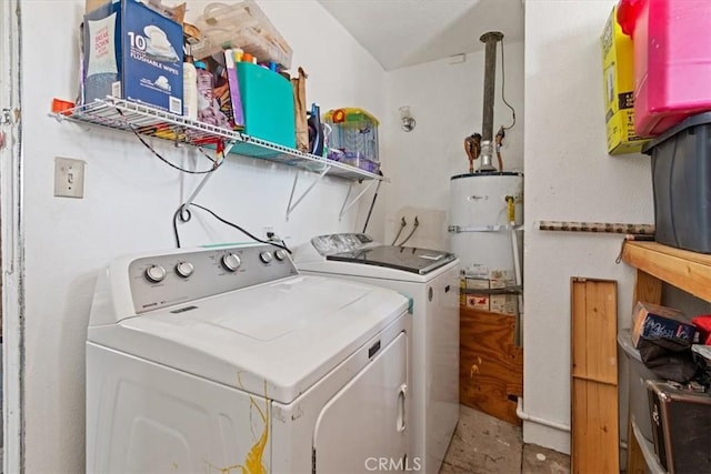 laundry room featuring secured water heater and separate washer and dryer