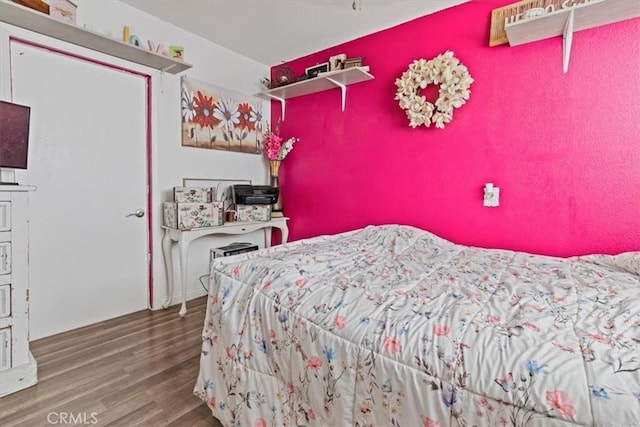 bedroom featuring hardwood / wood-style floors