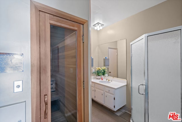 bathroom with vanity and walk in shower