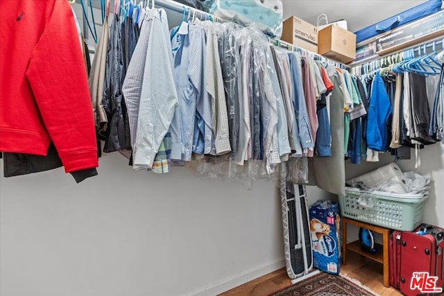 walk in closet featuring hardwood / wood-style flooring