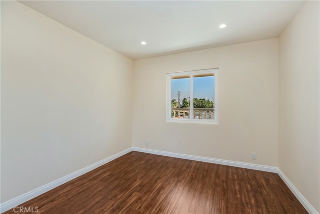 empty room featuring dark hardwood / wood-style floors