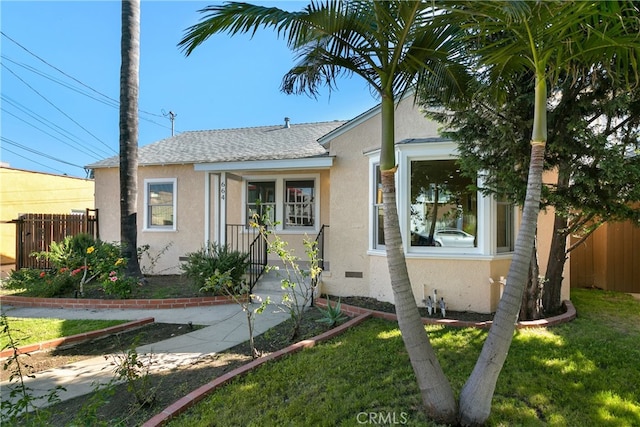 bungalow-style home with a front lawn