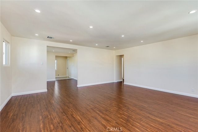 unfurnished room with dark hardwood / wood-style floors