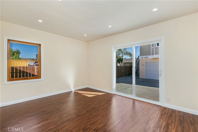 unfurnished room featuring hardwood / wood-style floors