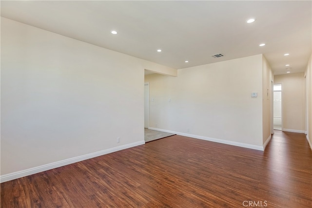 spare room featuring dark hardwood / wood-style floors