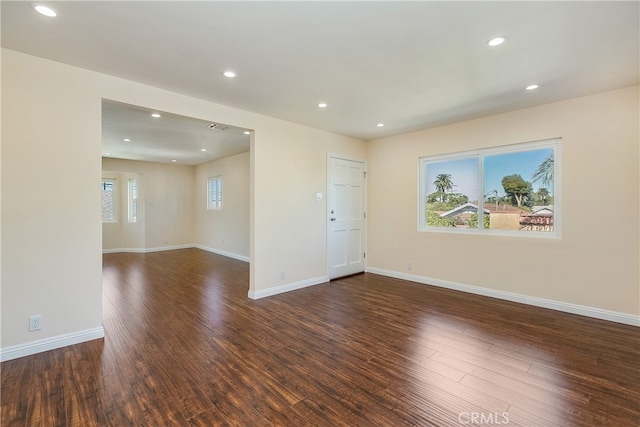 unfurnished room featuring dark hardwood / wood-style floors