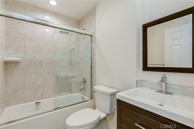 full bathroom with vanity, toilet, and enclosed tub / shower combo