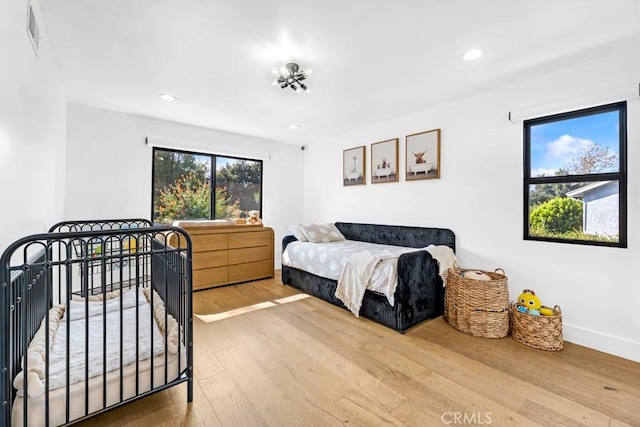 bedroom featuring wood-type flooring