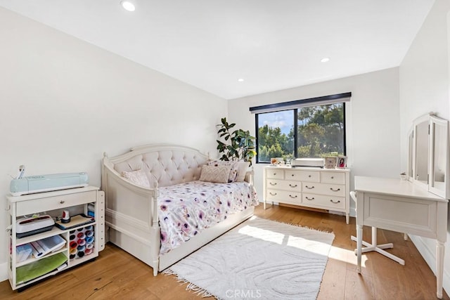 bedroom with light wood-type flooring