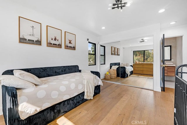 bedroom featuring hardwood / wood-style flooring and a closet