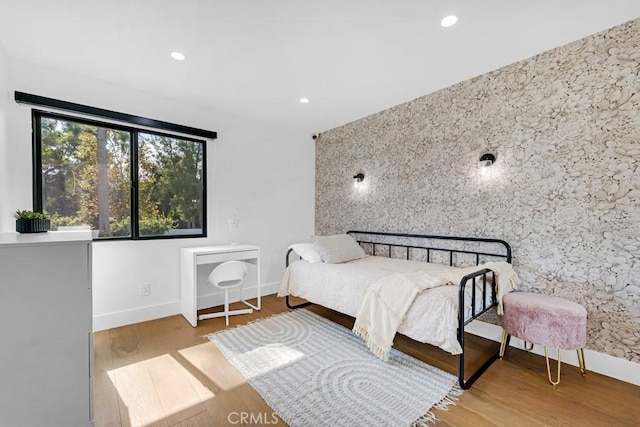 bedroom with light hardwood / wood-style flooring