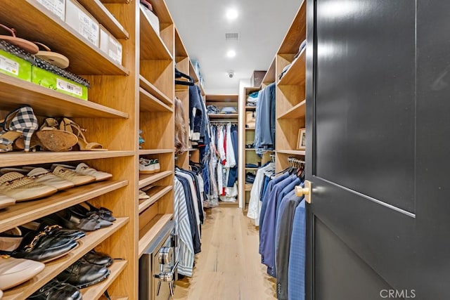 walk in closet featuring light wood-type flooring