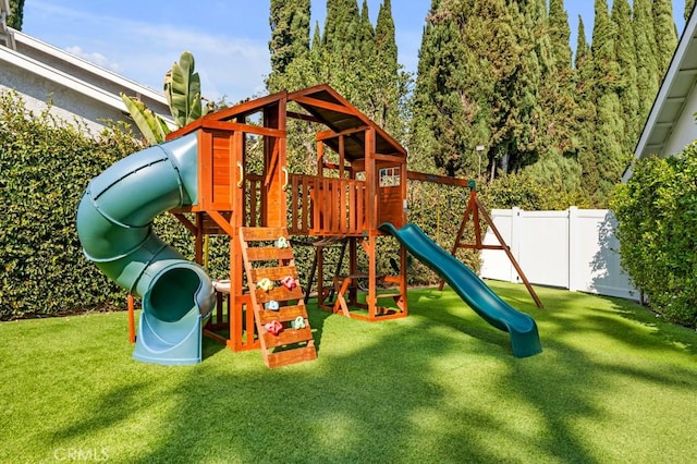 view of playground with a lawn