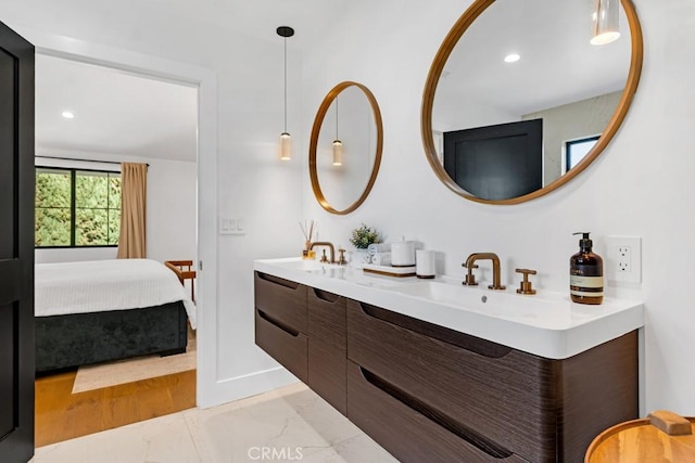 bathroom featuring hardwood / wood-style floors and vanity