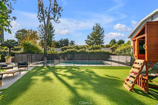 view of yard with a fenced in pool