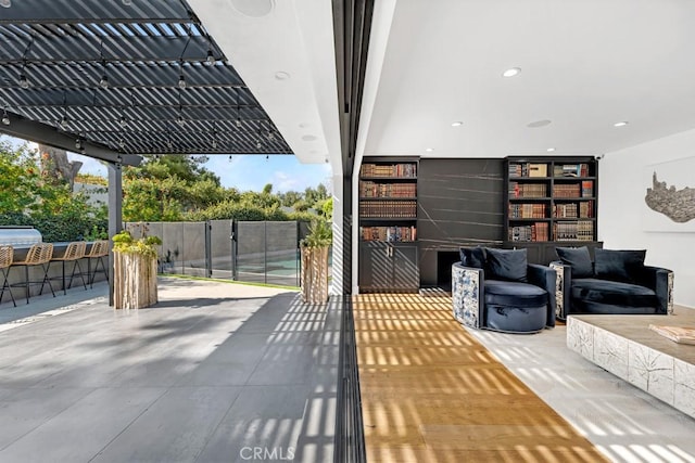 view of patio / terrace featuring an outdoor hangout area and an outdoor bar