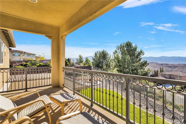 balcony featuring a mountain view